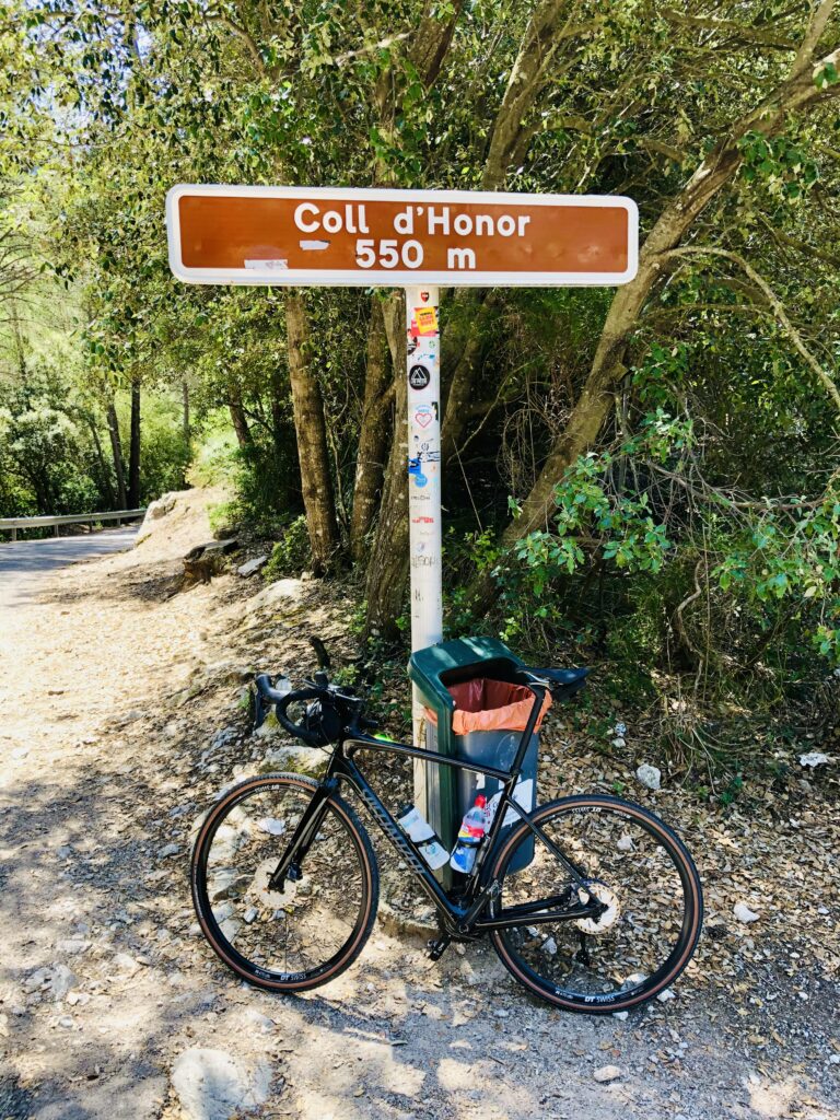 A gravel bike on a remote mountain trail in Mallorca, representing solo exploration and endurance cycling.